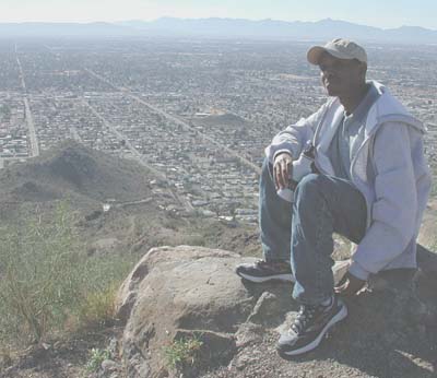 Kipng'etich takes in the view from Shaw Butte looking south towards
downtown Phoenix